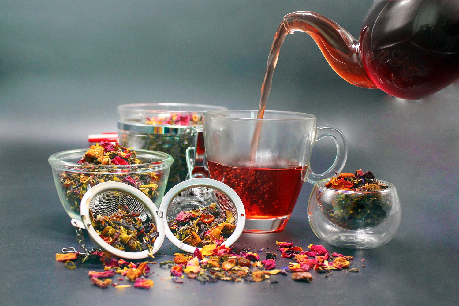 Teapot pouring and loose leaf tea